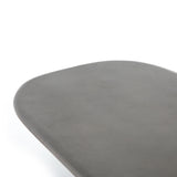 This Naya Outdoor Coffee Table is modern and curve-driven. Dark grey concrete forms a rounded rectangle top with bullnose edging, reminiscent of a shapely surfboard.  Cover or store inside during inclement weather.  Overall Dimensions: 46.00"w x 28.00"d x 16.00"h