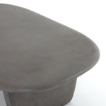 This Naya Outdoor Coffee Table is modern and curve-driven. Dark grey concrete forms a rounded rectangle top with bullnose edging, reminiscent of a shapely surfboard.  Cover or store inside during inclement weather.  Overall Dimensions: 46.00"w x 28.00"d x 16.00"h