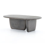 This Naya Outdoor Coffee Table is modern and curve-driven. Dark grey concrete forms a rounded rectangle top with bullnose edging, reminiscent of a shapely surfboard.  Cover or store inside during inclement weather.  Overall Dimensions: 46.00"w x 28.00"d x 16.00"h