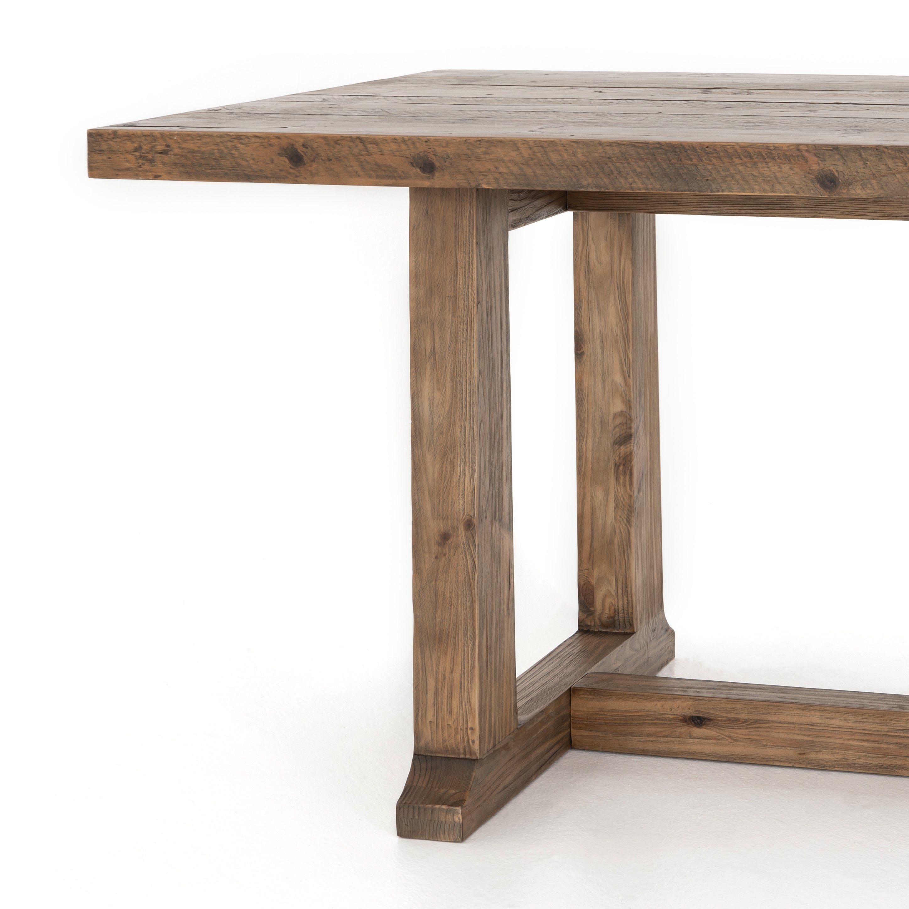 Bring a traditional sense to the table with this Otto Dining Table - 110". Finished in a warm honey hue, a trestle-style base of reclaimed pine supports a rectangular top of pine, waxed and bleached for a rustic look with natural depth.