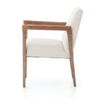 Elegance is no exaggeration with this Reuben Dining Chair - Harbor Natural. Slim, tapered oak with arms wrapped in vintage leather frames a floating seat covered in natural linen. We'd love to see this in your dining room, kitchen, or other space!  Overall Dimensions: 23.25"w x 25.50"d x 33.75"h