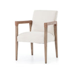 Elegance is no exaggeration with this Reuben Dining Chair - Harbor Natural. Slim, tapered oak with arms wrapped in vintage leather frames a floating seat covered in natural linen. We'd love to see this in your dining room, kitchen, or other space!  Overall Dimensions: 23.25"w x 25.50"d x 33.75"h
