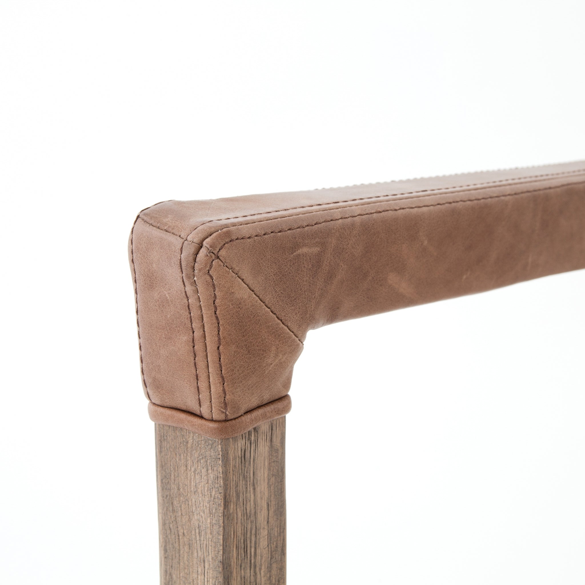 Elegance is no exaggeration with this Reuben Dining Chair - Harbor Natural. Slim, tapered oak with arms wrapped in vintage leather frames a floating seat covered in natural linen. We'd love to see this in your dining room, kitchen, or other space!  Overall Dimensions: 23.25"w x 25.50"d x 33.75"h