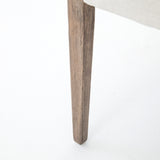 Elegance is no exaggeration with this Reuben Dining Chair - Harbor Natural. Slim, tapered oak with arms wrapped in vintage leather frames a floating seat covered in natural linen. We'd love to see this in your dining room, kitchen, or other space!  Overall Dimensions: 23.25"w x 25.50"d x 33.75"h