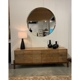 We love mid-century feel to this Reza Media Console - Smoked Honey. Finished in a light, smoked honey, a clean-lined parawood console sits in an arched cradle base of toasted acacia, for fresh contrast. Twist-lock metal hardware adds a clever finishing touch. Rear cutouts for media cord management. Amethyst Home provides interior design, new home construction design consulting, vintage area rugs, and lighting in the Des Moines metro area.