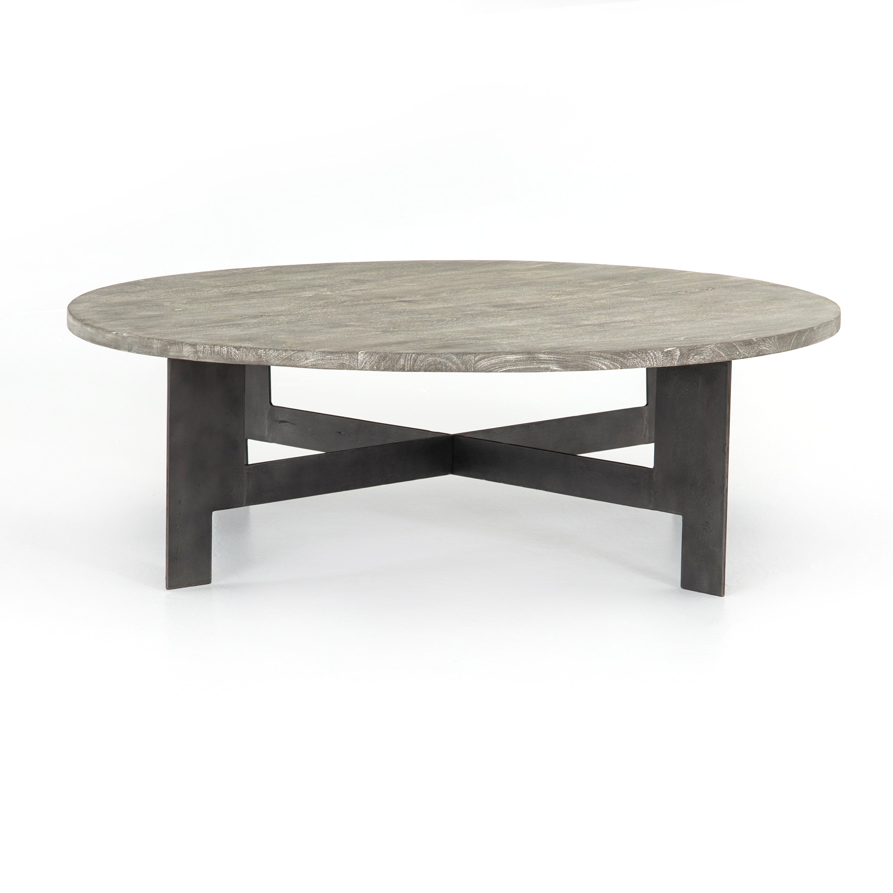 We love the thin iron gunmetal legs of this Round Coffee Table with Iron. The charcoal tones bring a neutral tone to any living room or lounge area.   Overall Dimensions: 48.00"w x 48.00"d x 15.50"h   Colors: Gunmetal, Charcoal Materials: Iron, Mango Wood Weight: 75.51 lb