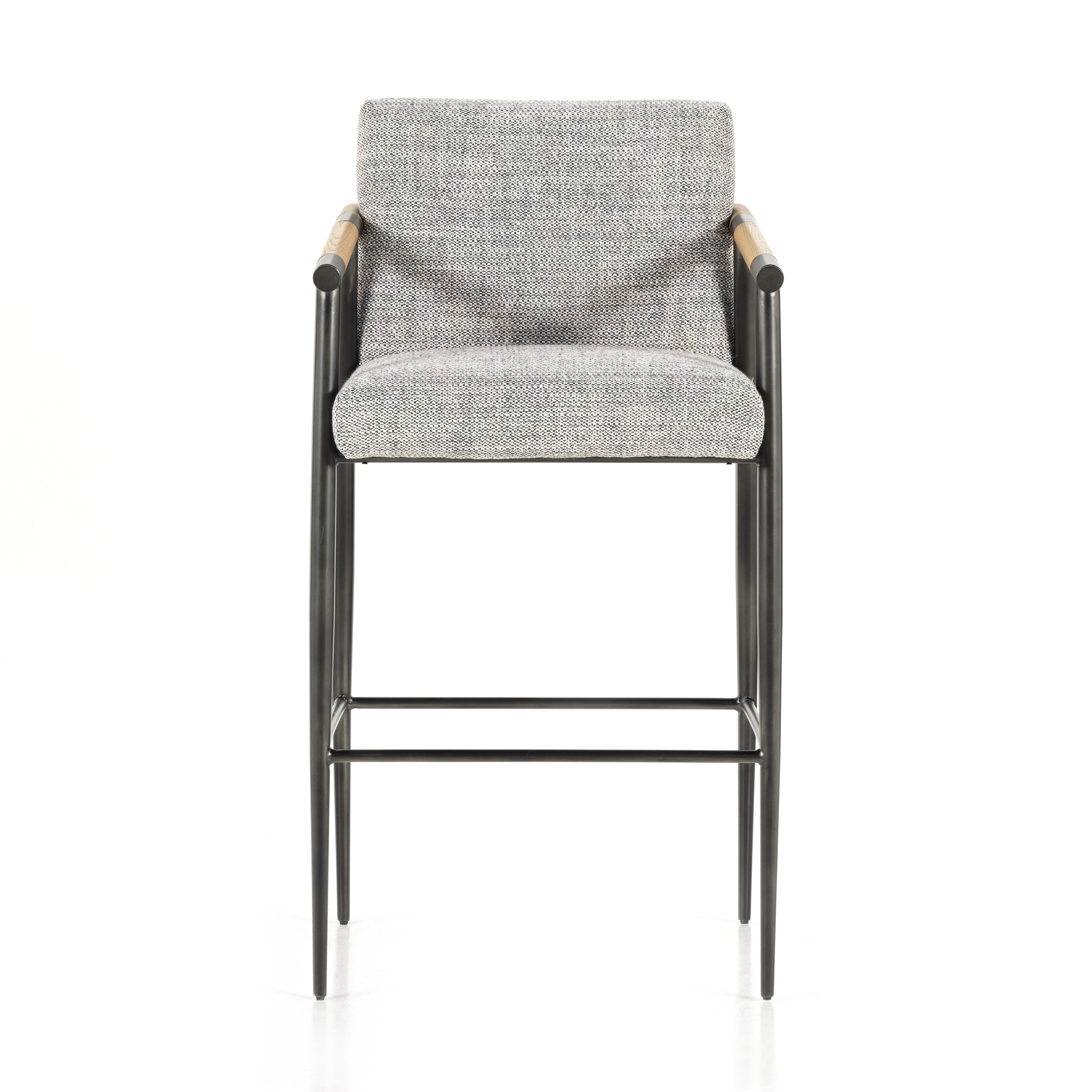 We love the textural grey seating upholstered in a high-performance fabric on this Rowen Bar + Counter Stool - Thames Raven. The angular solid oak arms and black-finished stainless steel framing is perfectly sized to elevate your bar or counter space. 