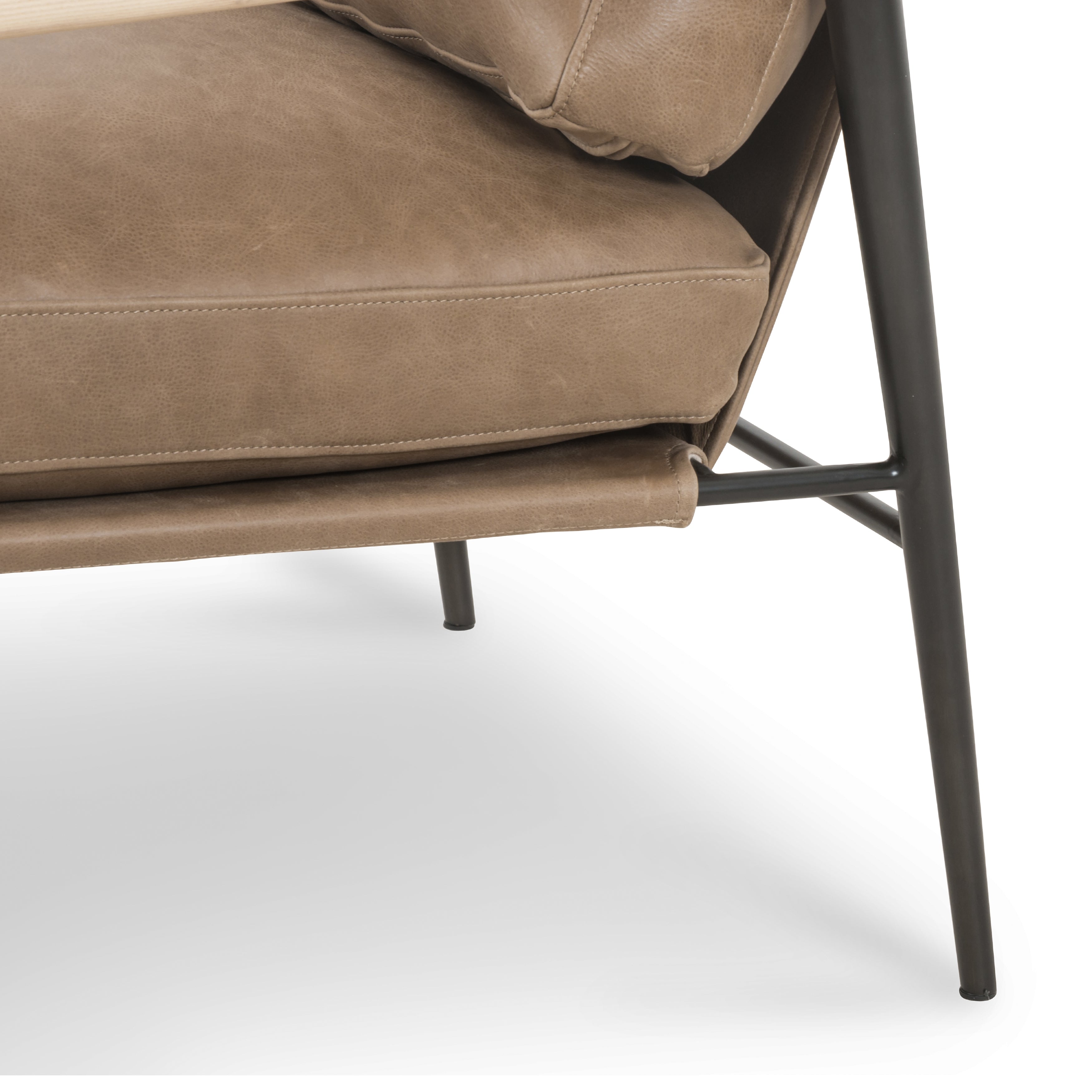 Featuring Rowen Chair - Palermo Drift by Four Hands at Amethyst Home. We love the slim, black steel frame of this Rowen Chair - Palermo Drift. Buttery, pronounced seating of tan top-grain leather with whitewashed ash accentuating angular arms make this an attractive seating choice for any living room, bedroom, or lounge area. 
Overall Dimensions: 27.50"W x 32".  Amethyst Home provides interior design, new home construction design consulting, vintage area rugs, and lighting in the Omaha metro area.