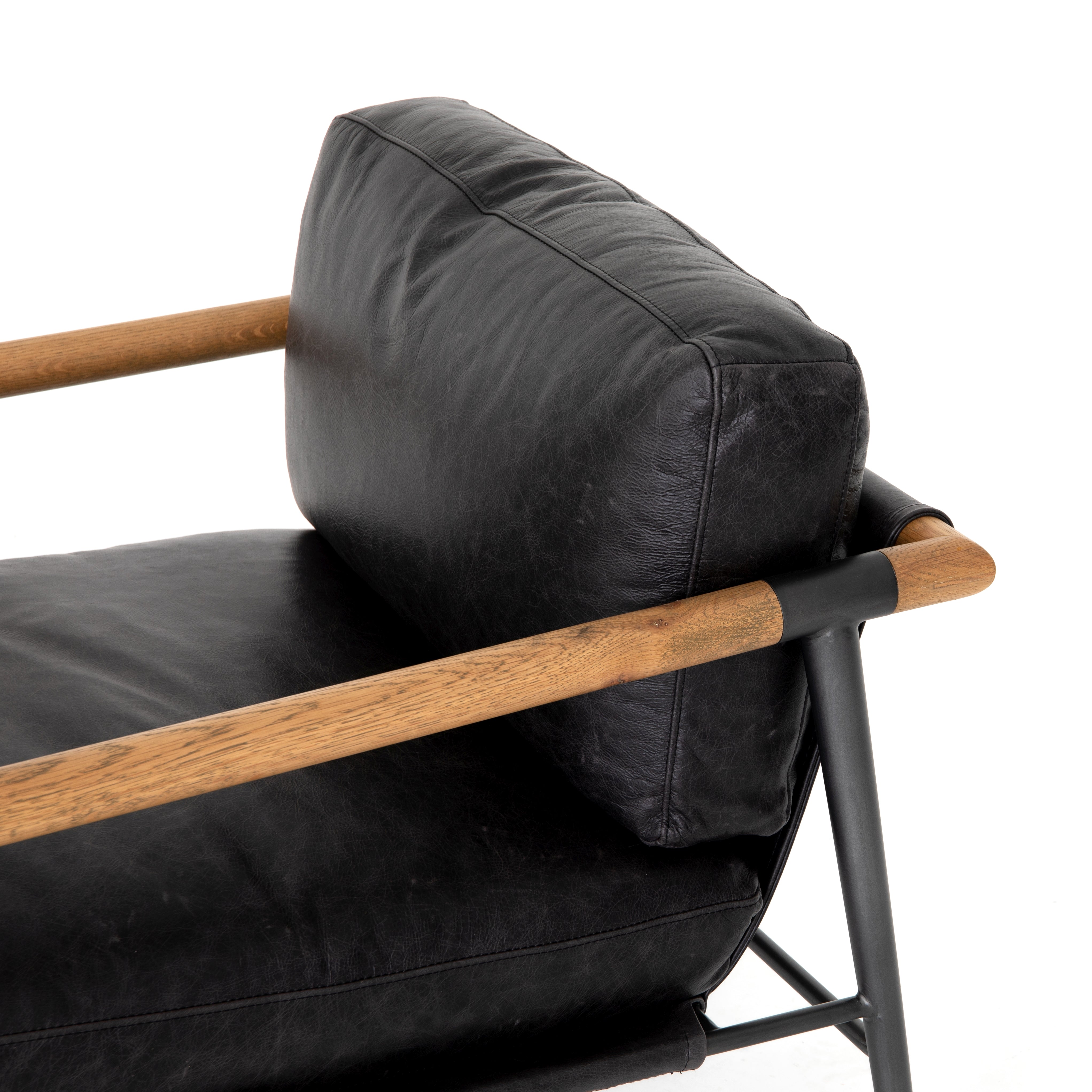 Featuring Rowen Chair - Sonoma Black by Four Hands at Amethyst Home. This Rowen Chair - Sonoma Black has buttery black seating of top-grain leather, with angular arms of exposed oak providing fresh contrast. A comfy, modern chair to add to any living room, bedroom, or other area. 
Overall Dimensions: 27.50"W x 32"L x 31"HColors: Toasted Oak, Sonoma Black, Carb.  Amethyst Home provides interior design, new home construction design consulting, vintage area rugs, and lighting in the Omaha metro area.