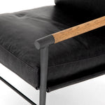 Featuring Rowen Chair - Sonoma Black by Four Hands at Amethyst Home. This Rowen Chair - Sonoma Black has buttery black seating of top-grain leather, with angular arms of exposed oak providing fresh contrast. A comfy, modern chair to add to any living room, bedroom, or other area. 
Overall Dimensions: 27.50"W x 32"L x 31"HColors: Toasted Oak, Sonoma Bla.  Amethyst Home provides interior design, new home construction design consulting, vintage area rugs, and lighting in the Winter Garden metro area.
