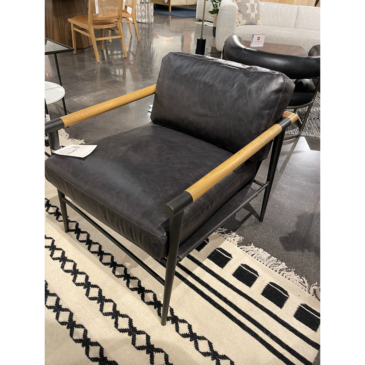 Featuring Rowen Chair - Sonoma Black by Four Hands at Amethyst Home. This Rowen Chair - Sonoma Black has buttery black seating of top-grain leather, with angular arms of exposed oak providing fresh contrast. A comfy, modern chair to add to any living room, bedroom, or other area. 
Overall Dimensions: 27.50"W x 32"L x 31"HColors: Toasted Oak, Sonoma Black, .  Amethyst Home provides interior design, new home construction design consulting, vintage area rugs, and lighting in the Charlotte metro area.