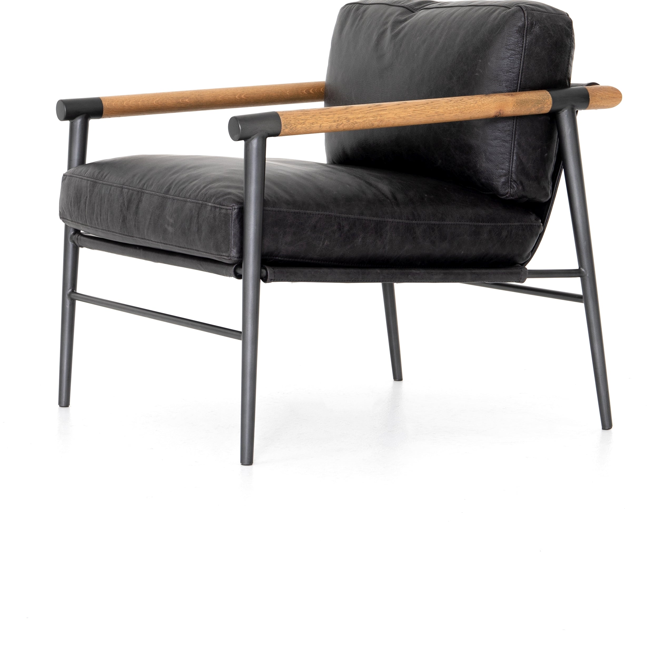 Featuring Rowen Chair - Sonoma Black by Four Hands at Amethyst Home. This Rowen Chair - Sonoma Black has buttery black seating of top-grain leather, with angular arms of exposed oak providing fresh contrast. A comfy, modern chair to add to any living room, bedroom, or other area. 
Overall Dimensions: 27.50"W x 32"L x 31"HColors: Toasted Oak, Sonoma Black, Car.  Amethyst Home provides interior design, new home construction design consulting, vintage area rugs, and lighting in the Boston metro area.