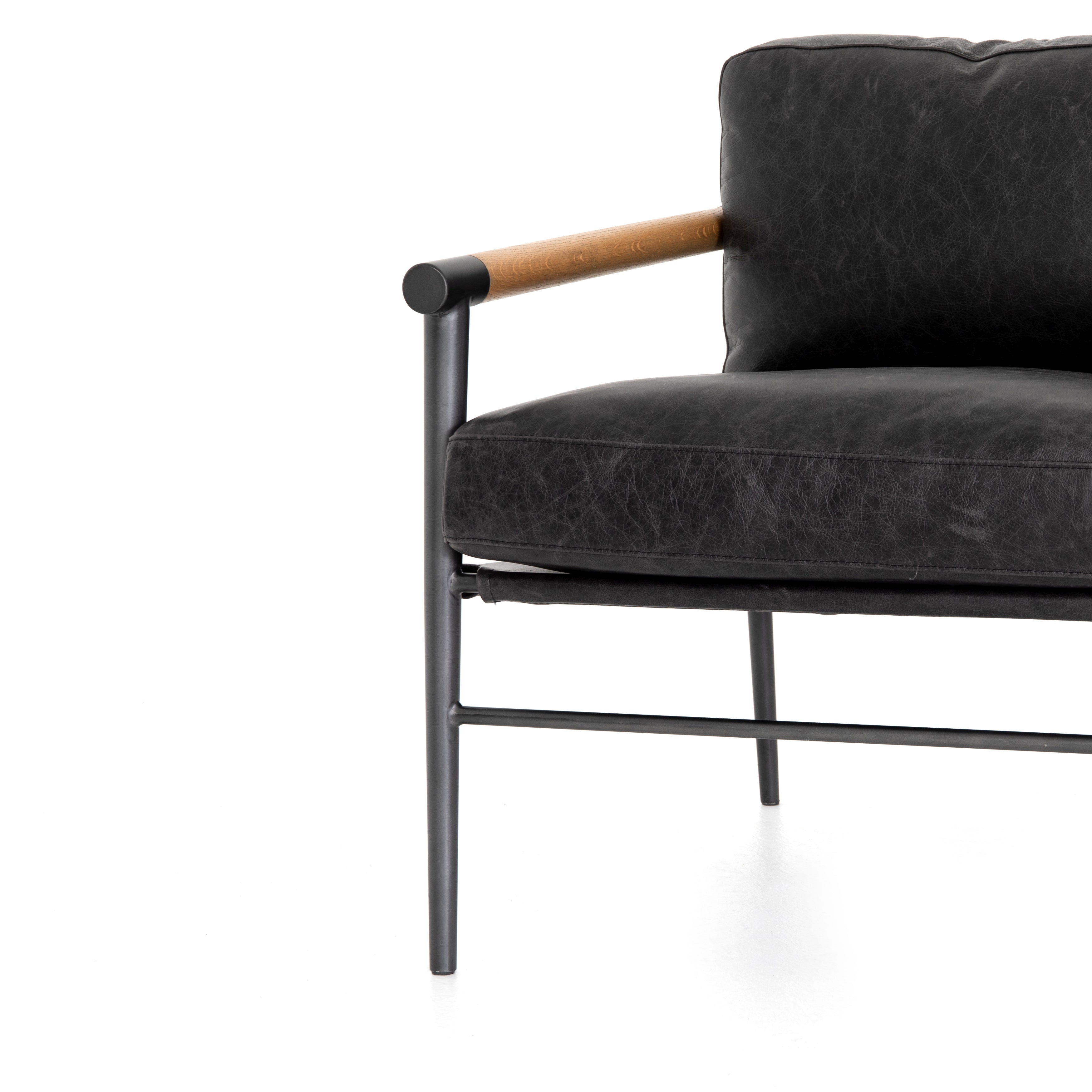 Featuring Rowen Chair - Sonoma Black by Four Hands at Amethyst Home. This Rowen Chair - Sonoma Black has buttery black seating of top-grain leather, with angular arms of exposed oak providing fresh contrast. A comfy, modern chair to add to any living room, bedroom, or other area. 
Overall Dimensions: 27.50"W x 32"L x 31"HColors: Toasted Oak, Sonoma Black, Car.  Amethyst Home provides interior design, new home construction design consulting, vintage area rugs, and lighting in the Boston metro area.