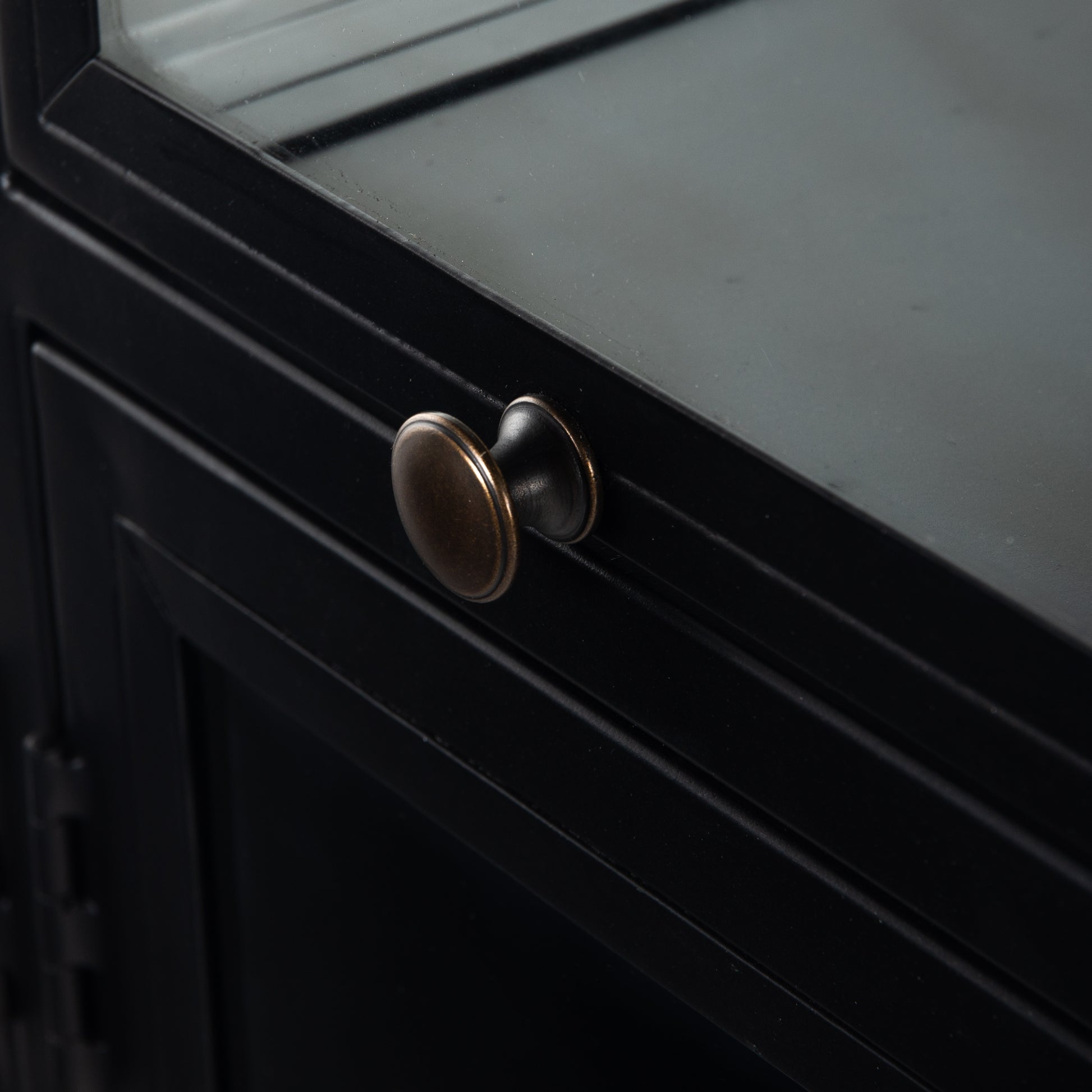 This Shadow Box Sideboard gives your inner collector a place to play. Store prized possessions behind clear glass fronts, with black-finished metal casing and brass hardware for contrast.  Overall Dimensions: 70.00"w x 17.25"d x 35.00"h