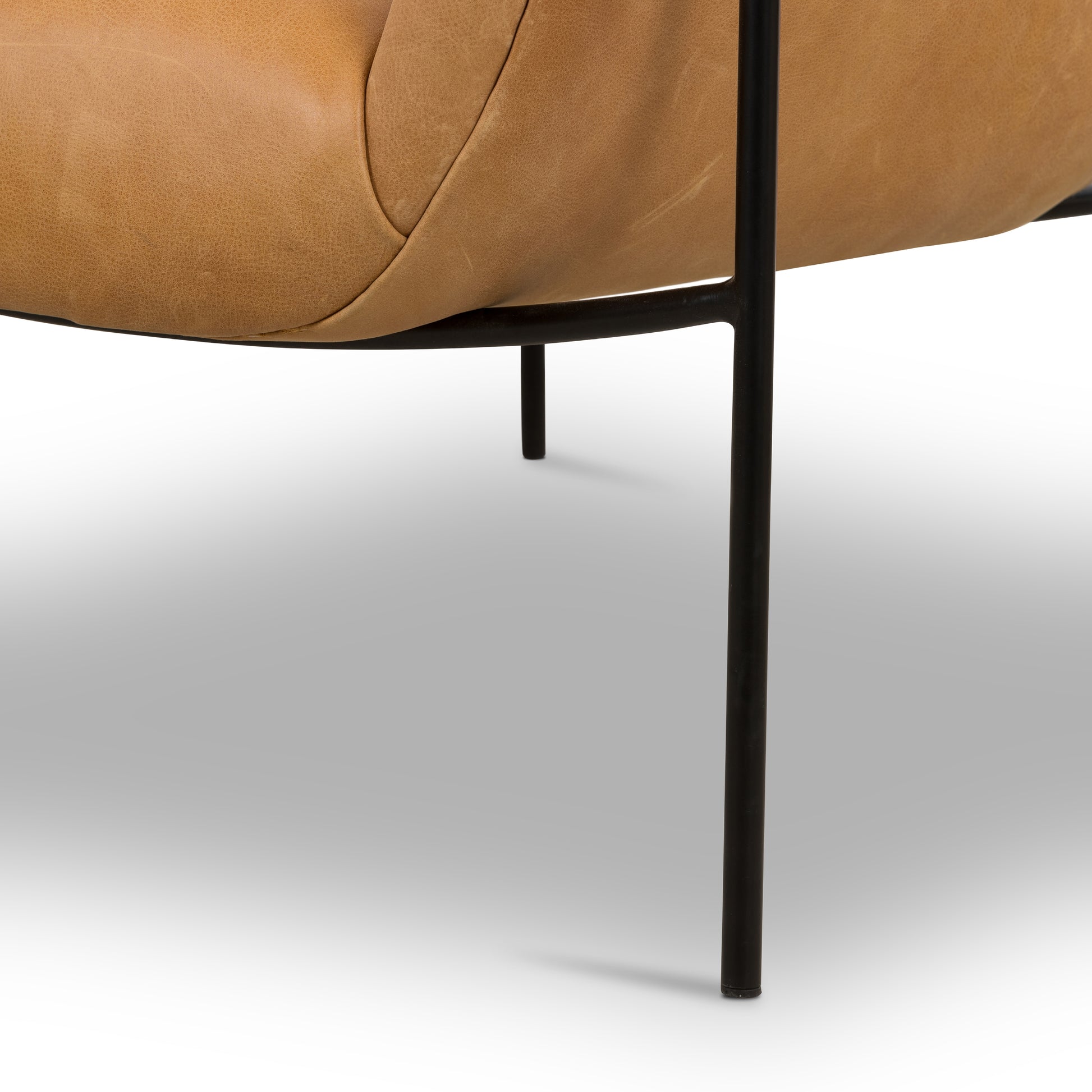 With a curvy silhouette and classic rolled arms, this Suerte Chair - Palermo Butterscotch has butterscotch leather that lends a fresh feel to vintage-inspired accent seating. The airy iron cradle base brings a beautiful balance of scale to any living room or office!  Overall Dimensions: 35.00"w x 33.50"d x 31.00"h