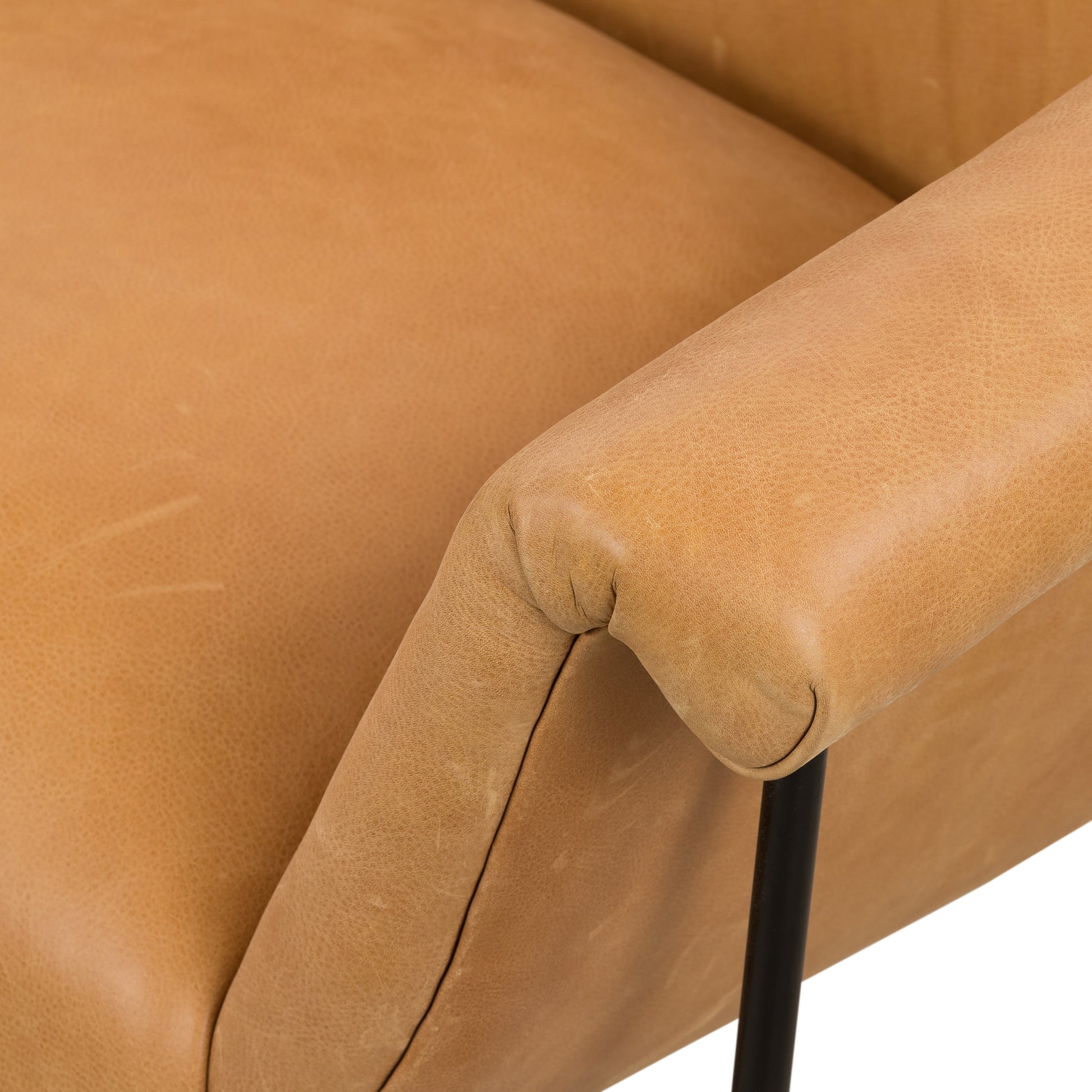 With a curvy silhouette and classic rolled arms, this Suerte Chair - Palermo Butterscotch has butterscotch leather that lends a fresh feel to vintage-inspired accent seating. The airy iron cradle base brings a beautiful balance of scale to any living room or office!  Overall Dimensions: 35.00"w x 33.50"d x 31.00"h