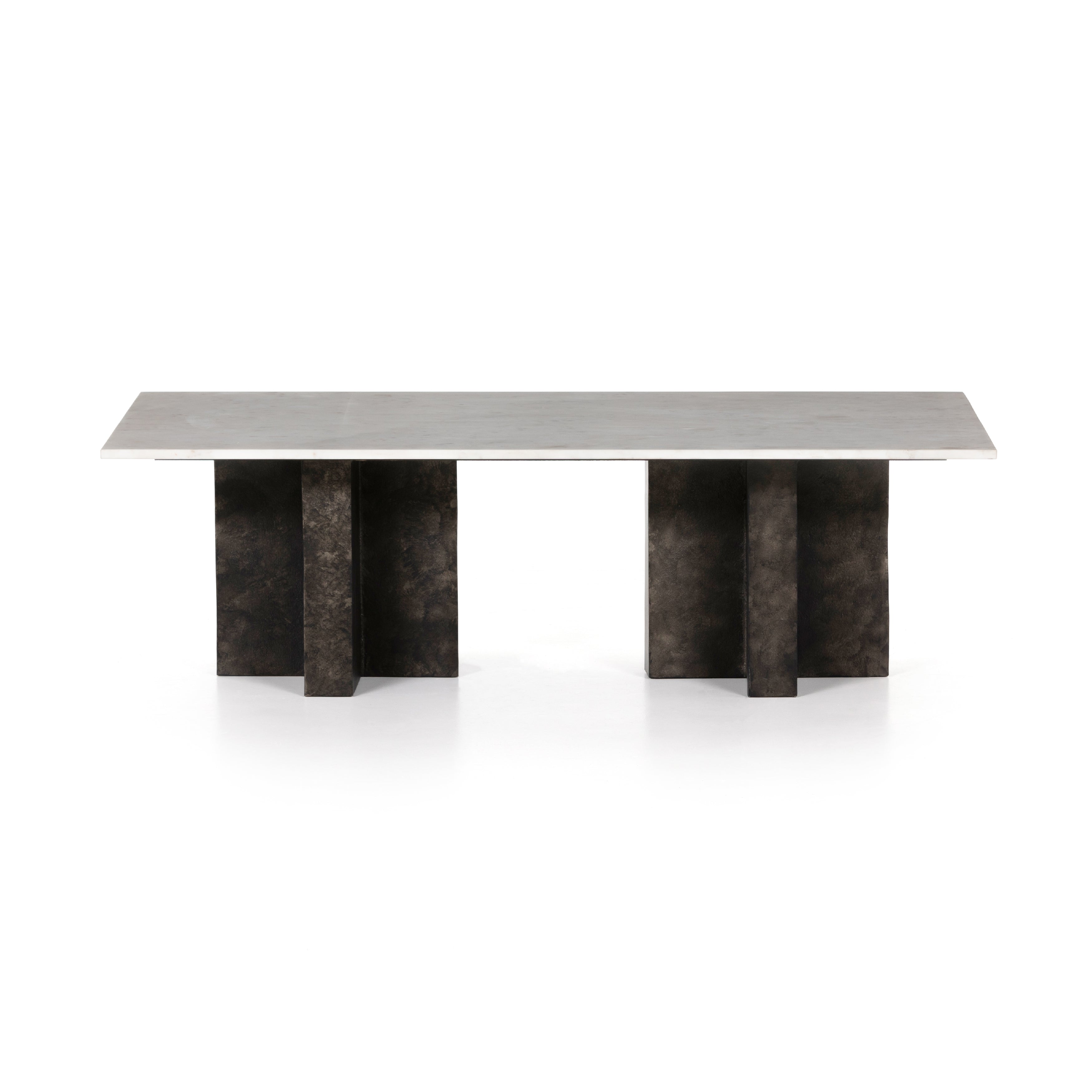 We love the legs of this Terrell Coffee Table - Raw Black. Finished in a raw black, uniquely angular cast aluminum legs support a rectangular tabletop of solid marble in a clean, polished white - a sleek, modern look to add in any living room or lounge area.   Overall Dimensions: 55.00"w x 29.00"d x 16.50"h