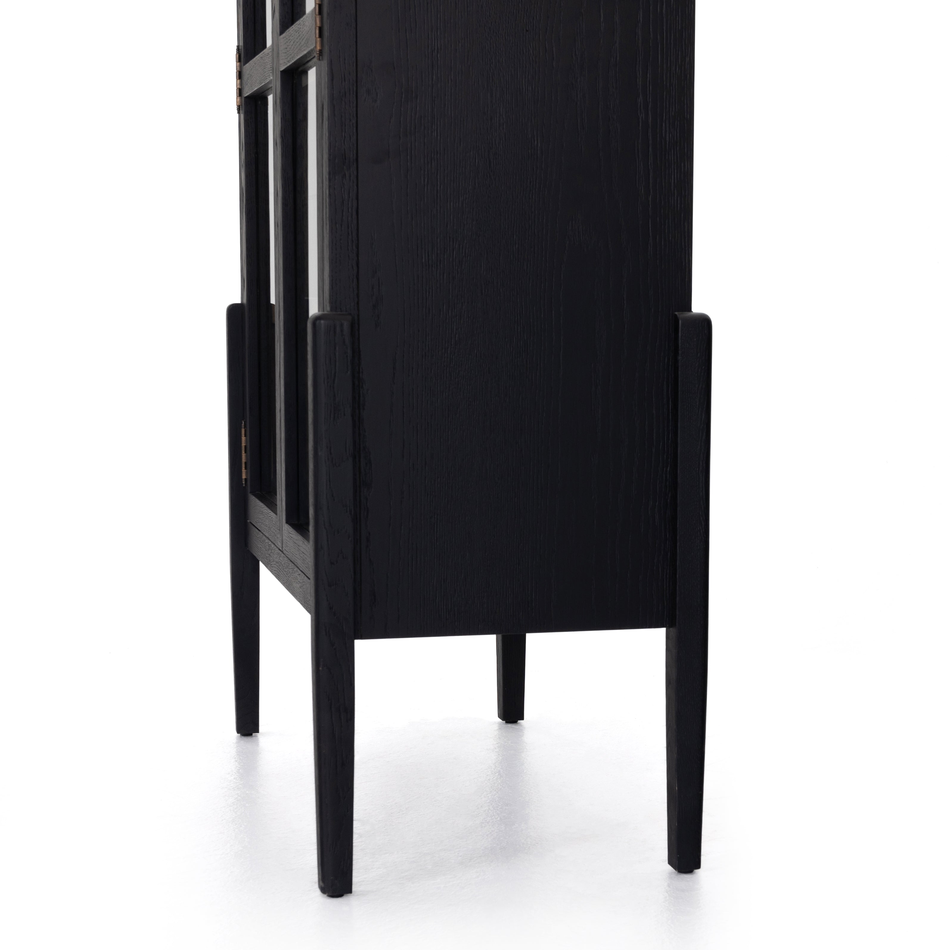 Store it in style with this Tolle Cabinet - Drifted Oak. Beautifully shaped cabinetry of black solid oak features spacious interior shelving and clear glass front, ready for displaying favorite books, photos and treasures in any room!  Overall Dimensions: 38.00"w x 19.00"d x 84.00"h