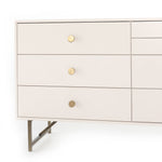 Featuring Van 7 Drawer Dresser - Matte Alabaster by Four Hands at Amethyst Home. This Van 7 Drawer Dresser - Matte Alabaster is finished in a dreamy off-white and aged-brass finished hardware to finish the look. This features five spacious drawers and two smaller velvet-lined drawers perfect for storing your favorite jewelry. 
Overall Dimensions: 58"W x 19"L .  Amethyst Home provides interior design, new home construction design consulting, vintage area rugs, and lighting in the Boston metro area.
