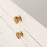 Featuring Van 7 Drawer Dresser - Matte Alabaster by Four Hands at Amethyst Home. This Van 7 Drawer Dresser - Matte Alabaster is finished in a dreamy off-white and aged-brass finished hardware to finish the look. This features five spacious drawers and two smaller velvet-lined drawers perfect for storing your favorite jewelry. 
Overall Dimensions: 58"W x 1.  Amethyst Home provides interior design, new home construction design consulting, vintage area rugs, and lighting in the Des Moines metro area.