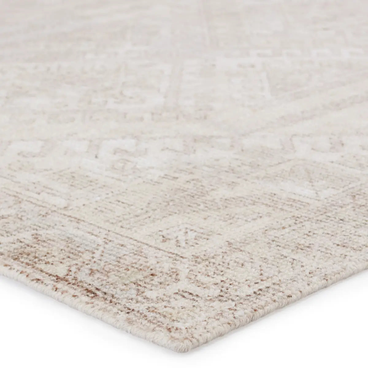 The handwoven Blythe Arlowe Silver Birch / Winter White Area Rug by Jaipur Living  features a cut-loop pile and soft-yet-textured feel. The blend of natural wool and luxe rayon made from bamboo grounds spaces with soft, inviting texture.