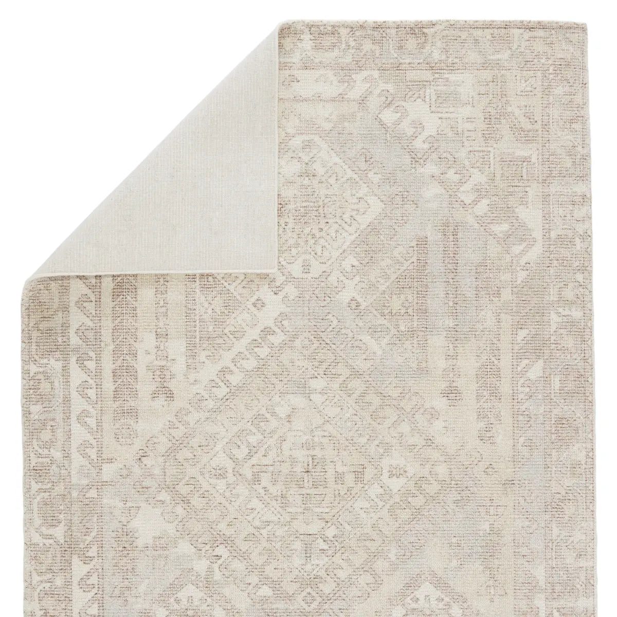 The handwoven Blythe Arlowe Silver Birch / Winter White Area Rug by Jaipur Living  features a cut-loop pile and soft-yet-textured feel. The blend of natural wool and luxe rayon made from bamboo grounds spaces with soft, inviting texture.