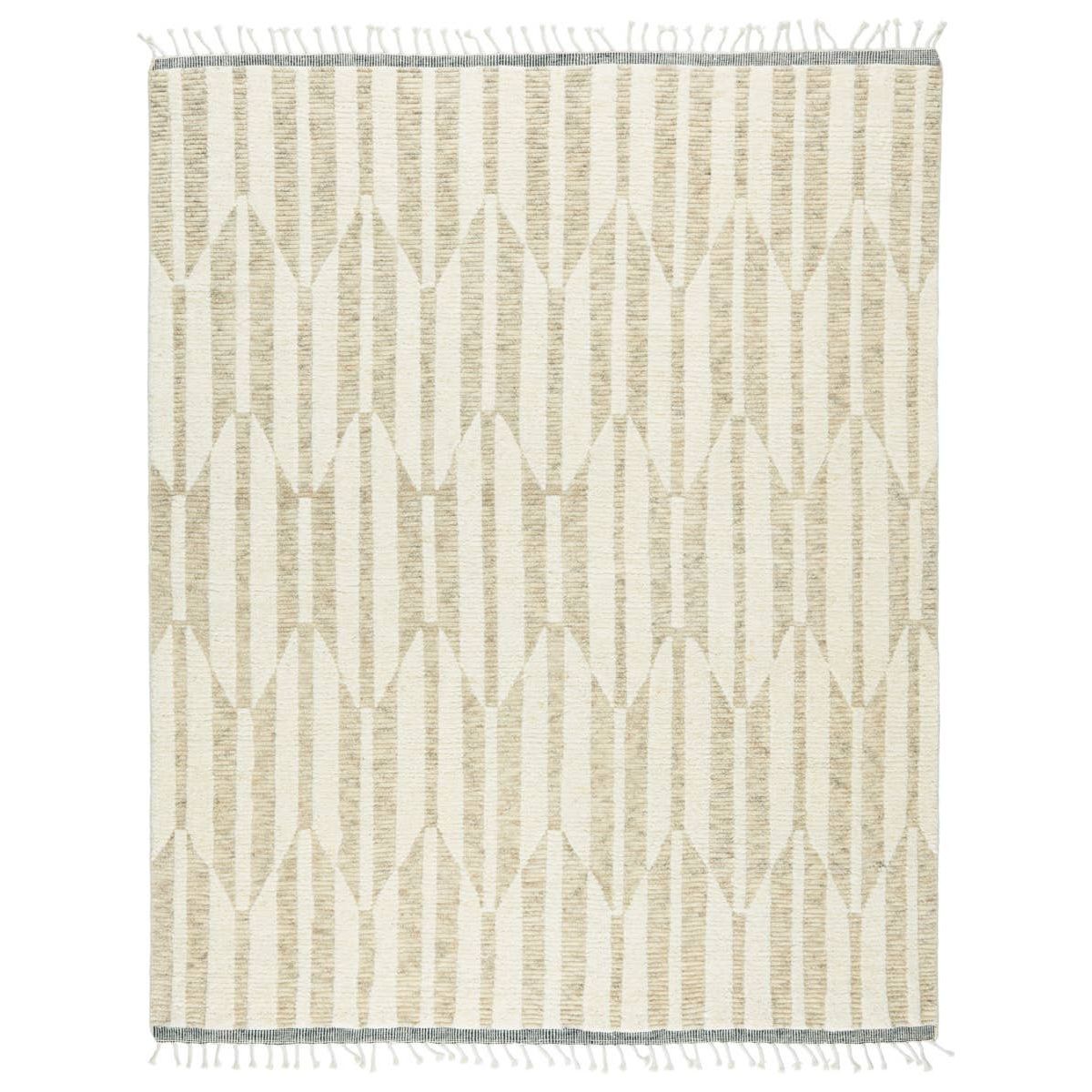 The Keoka Quest Area Rug by Jaipur Living, or KEO01 features tones of beige, light gray, and ivory. The light and airy colorway of the Quest rug anchors room with versatility and neutral appeal. The texture-rich wool pile features a ribbed construction that lends unique linear details to the dynamic geometric patterns.