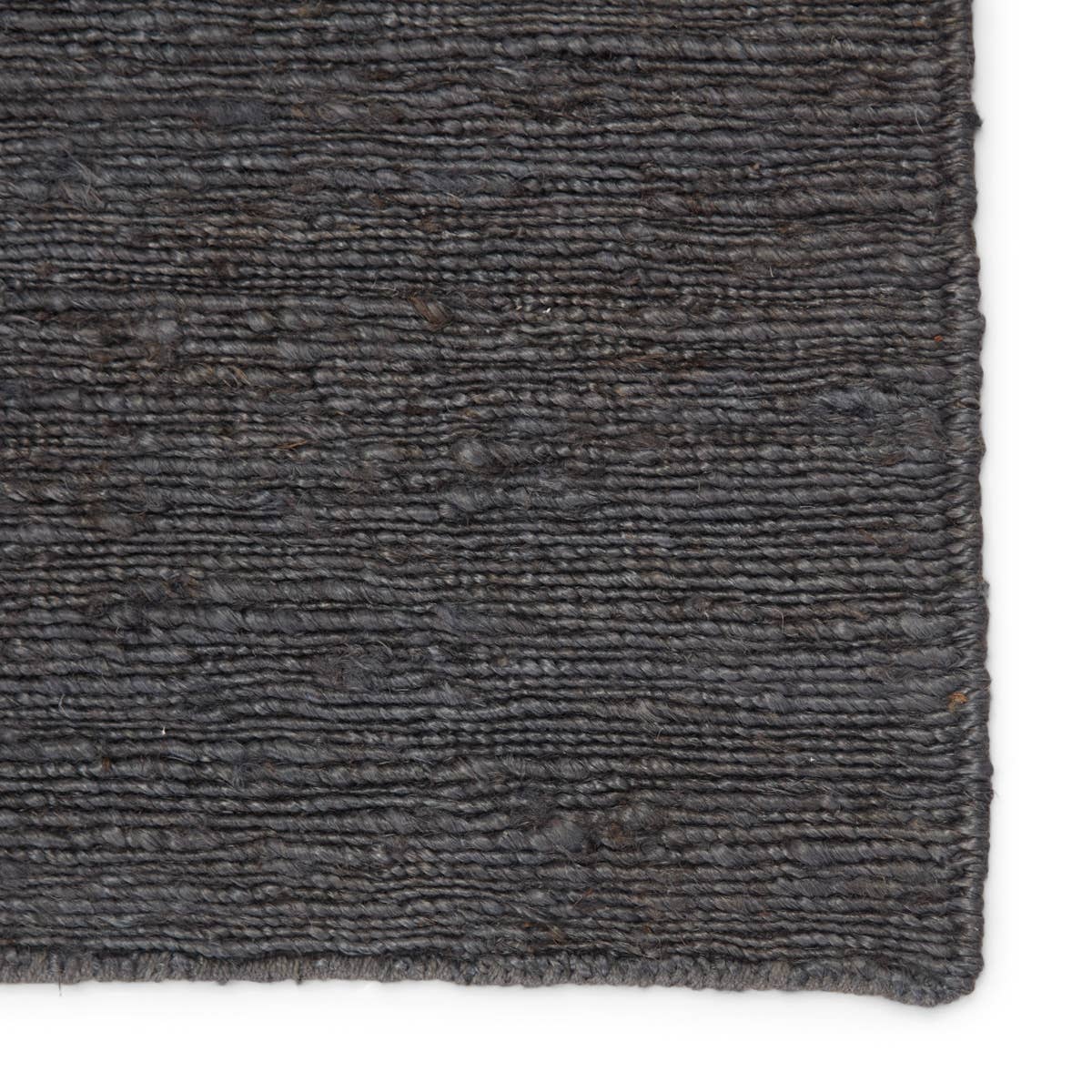 Featuring Sabine Linden Darkshadow/Ebony Rug by Jaipur Living at Amethyst Home. The Sabine collection lends rich texture and organic allure to modern homes. The Linden area rug features a fine, single-line Sumak knotting technique for an exquisite feel and craftsmanship. This rich, black natural area rug is the perfect accent for sophisticated spaces in wan.  Amethyst Home provides interior design, new home construction design consulting, vintage area rugs, and lighting in the Portland metro area.