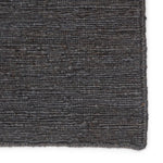 Featuring Sabine Linden Darkshadow/Ebony Rug by Jaipur Living at Amethyst Home. The Sabine collection lends rich texture and organic allure to modern homes. The Linden area rug features a fine, single-line Sumak knotting technique for an exquisite feel and craftsmanship. This rich, black natural area rug is the perfect accent for sophisticated spaces in wan.  Amethyst Home provides interior design, new home construction design consulting, vintage area rugs, and lighting in the Portland metro area.