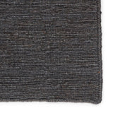 Featuring Sabine Linden Darkshadow/Ebony Rug by Jaipur Living at Amethyst Home. The Sabine collection lends rich texture and organic allure to modern homes. The Linden area rug features a fine, single-line Sumak knotting technique for an exquisite feel and craftsmanship. This rich, black natural area rug is the perfect accent for sophisticated spaces in wan.  Amethyst Home provides interior design, new home construction design consulting, vintage area rugs, and lighting in the Portland metro area.