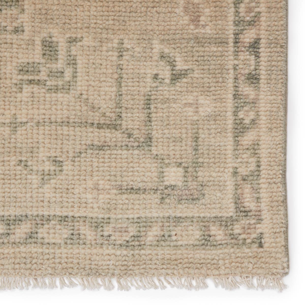 Featuring Salinas Ginerva Seedpearl Hand-Knotted Rug by Jaipur Living at Amethyst Home. The Salinas collection is punctuated by traditional, intricate details and a soft, hand-knotted wool construction. The neutral Ginerva area rug makes a transitional statement with green-gray and cream hues and vintage motifs. This durable, artisan-made rug boasts a distres.  Amethyst Home provides interior design, new home construction design consulting, vintage area rugs, and lighting in the Boston metro area.
