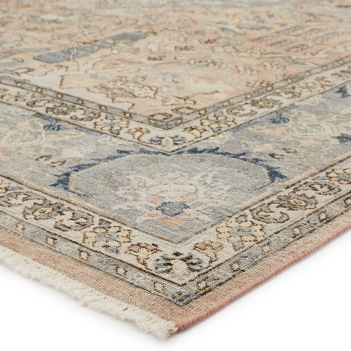 The Someplace in Time Pendulum Area Rug from Jaipur Living, or SPT09, features neutral tones of tan, beige, and gray. The inviting Pendulum rug ground spaces with luxe appeal and an exceptional hand-knotted quality. Crafted of handspun wool, this artisan-made rug boasts an authentic, timeworn look.