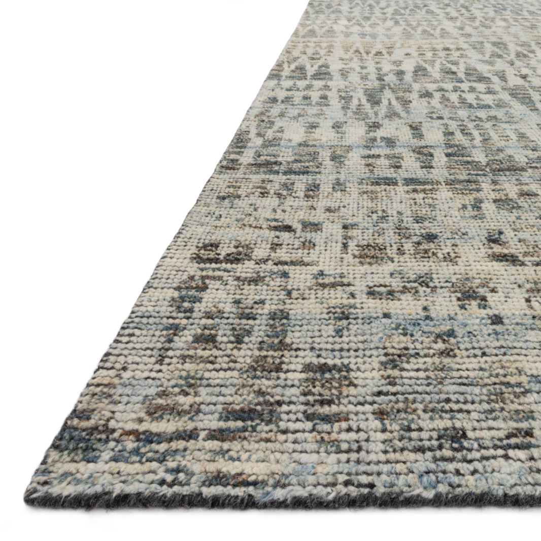 Hand-knotted in India of 100% wool, the Amara Natural/Ocean Area Rug creates a casual yet refined vibe with high-end appeal. Showcase in your living room, bedroom, entryway, or other high traffic area.   Hand Knotted 100% Wool AMM-07 Natural/Ocean