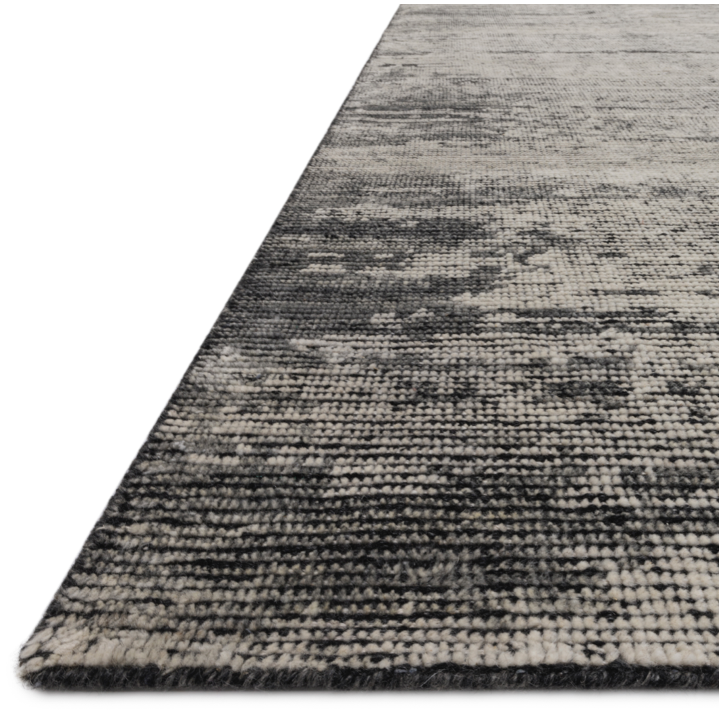 Hand-knotted in India of 100% wool, the Amara Silver/Dark Grey Rug creates a casual yet refined vibe with high-end appeal. Showcase in your bedroom, living room, entryway, or other high-traffic area of your home.   Hand Knotted 100% Wool AMM-02 Silver/Dark Grey