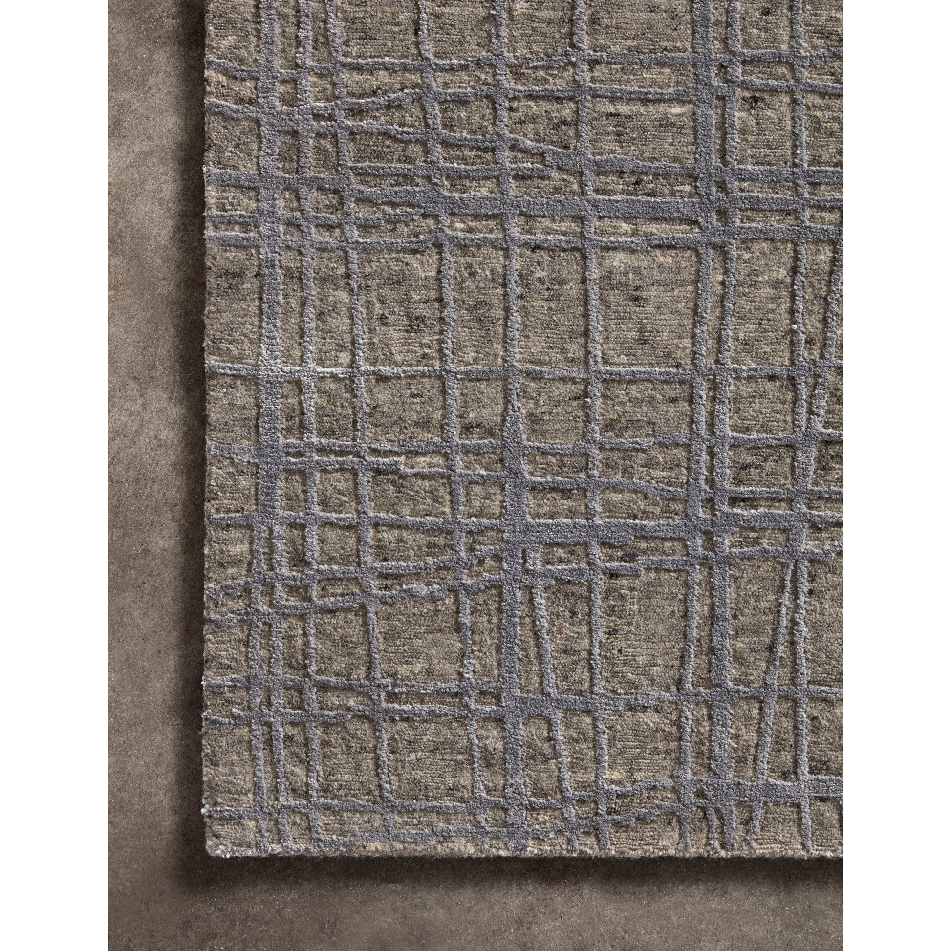 The Atlas Sage / Stone Area Rug by Loloi, or ATL-02, showcases striking contemporary patterns with a sophisticated color palette. Bold yet approachable, Atlas' muted linear designs create a sense of refined movement. Hand Knotted. Wool | Nylon