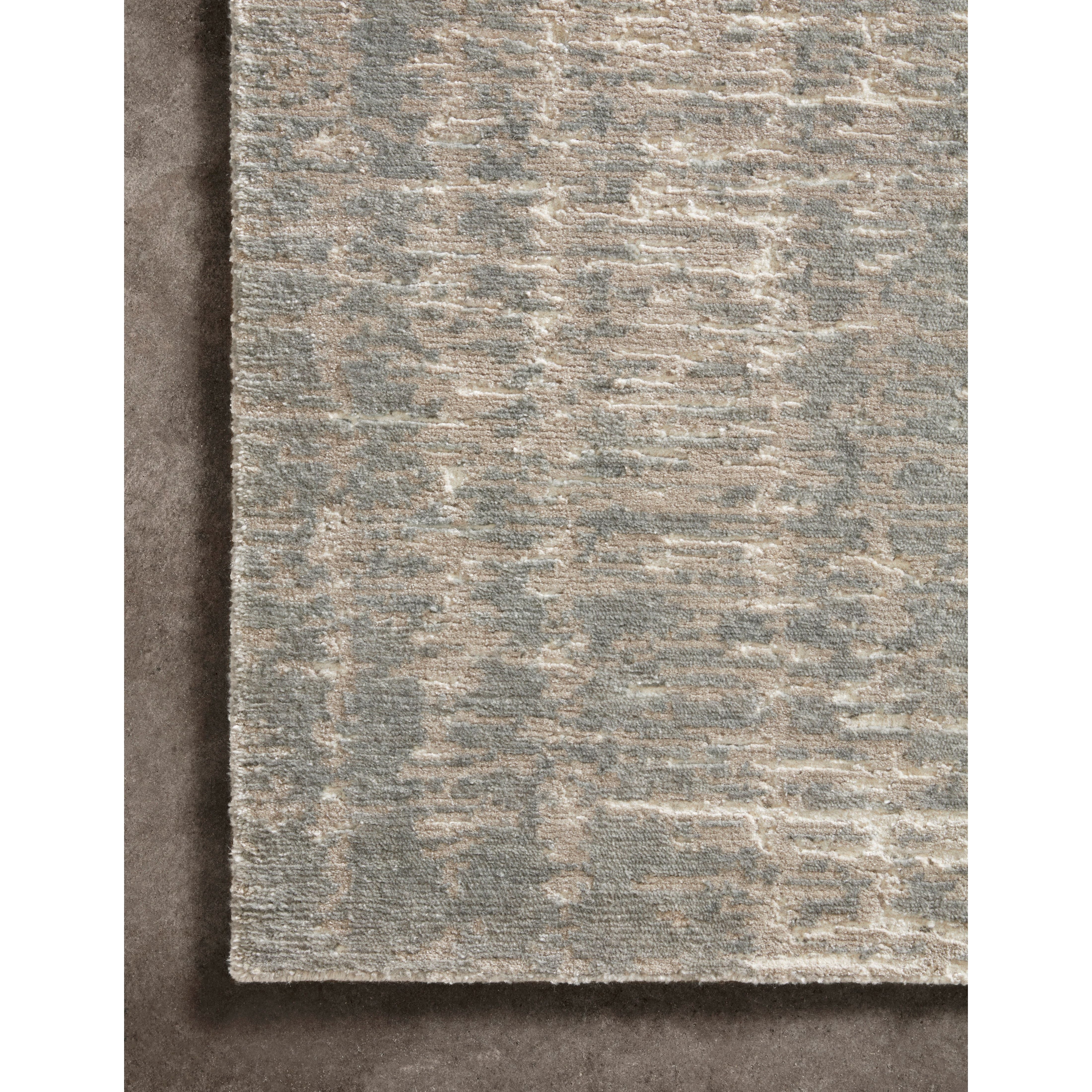 The Atlas Ivory / Pewter Area Rug by Loloi, or ATL-01, showcases striking contemporary patterns with a sophisticated color palette. Bold yet approachable, Atlas' muted linear designs create a sense of refined movement. Hand Knotted. Wool | Nylon
