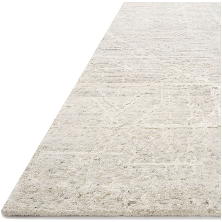 The Atlas Bone / Silver Area Rug by Loloi, or ATL-03, showcases striking contemporary patterns with a sophisticated color palette. Bold yet approachable, Atlas' muted linear designs create a sense of refined movement. Hand Knotted. Wool | Nylon