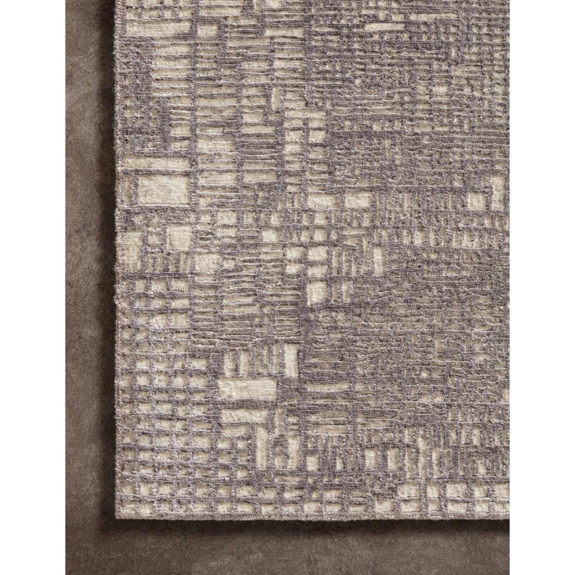 The Atlas Grey / Natural Area Rug by Loloi, or ATL-04, showcases striking contemporary patterns with a sophisticated color palette. Bold yet approachable, Atlas' muted linear designs create a sense of refined movement. Hand Knotted. Wool | Nylon