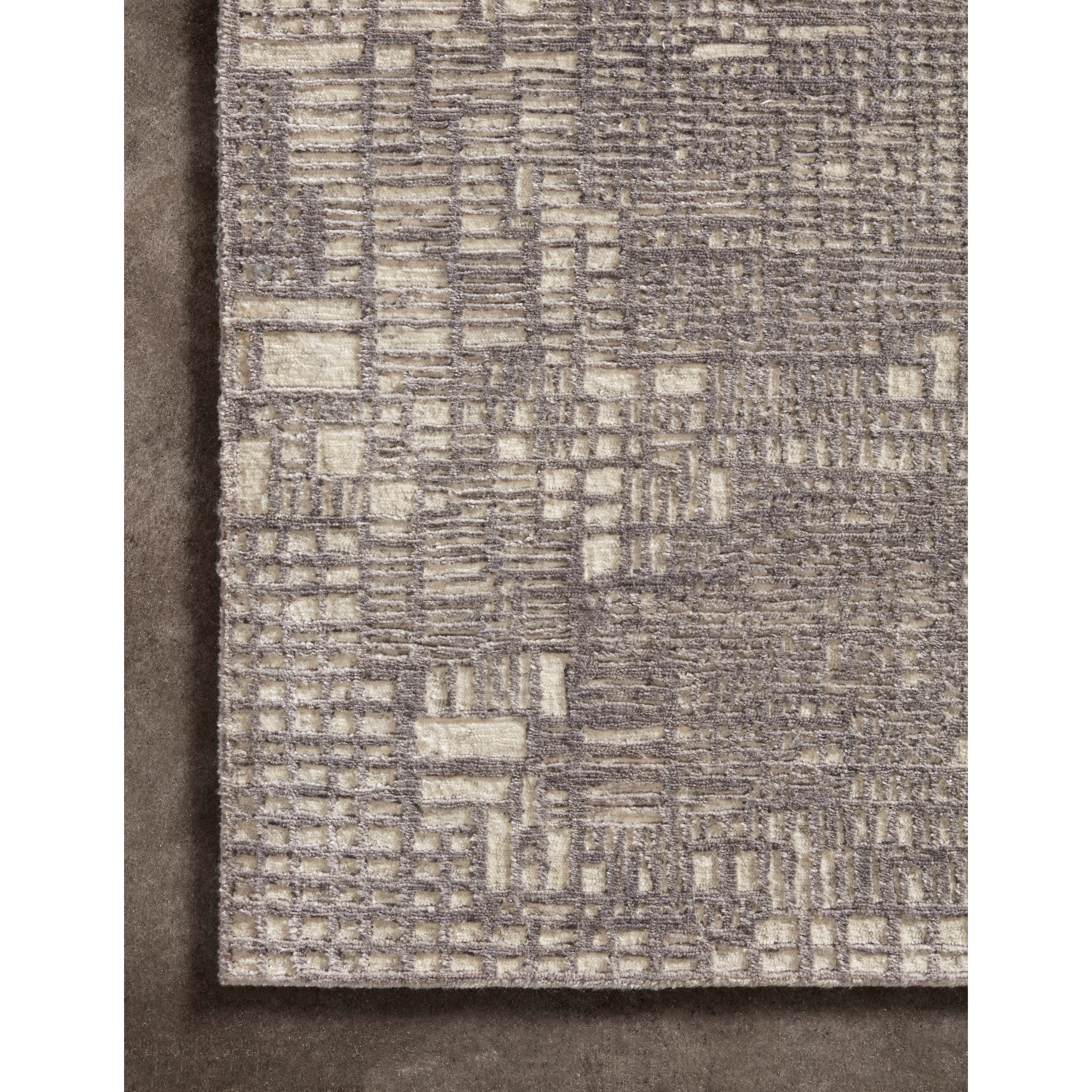 The Atlas Grey / Natural Area Rug by Loloi, or ATL-04, showcases striking contemporary patterns with a sophisticated color palette. Bold yet approachable, Atlas' muted linear designs create a sense of refined movement. Hand Knotted. Wool | Nylon