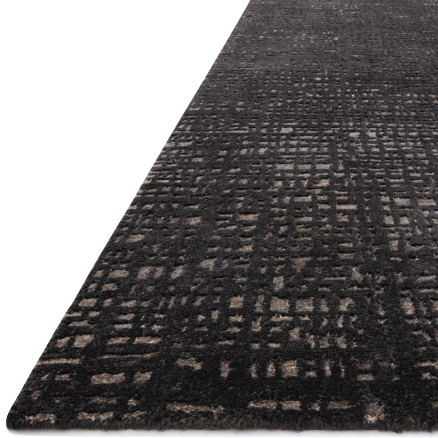 The Atlas Black / Bark Area Rug by Loloi, or ATL-05, showcases striking contemporary patterns with a sophisticated color palette. Bold yet approachable, Atlas' muted linear designs create a sense of refined movement. Hand Knotted. Wool | Nylon