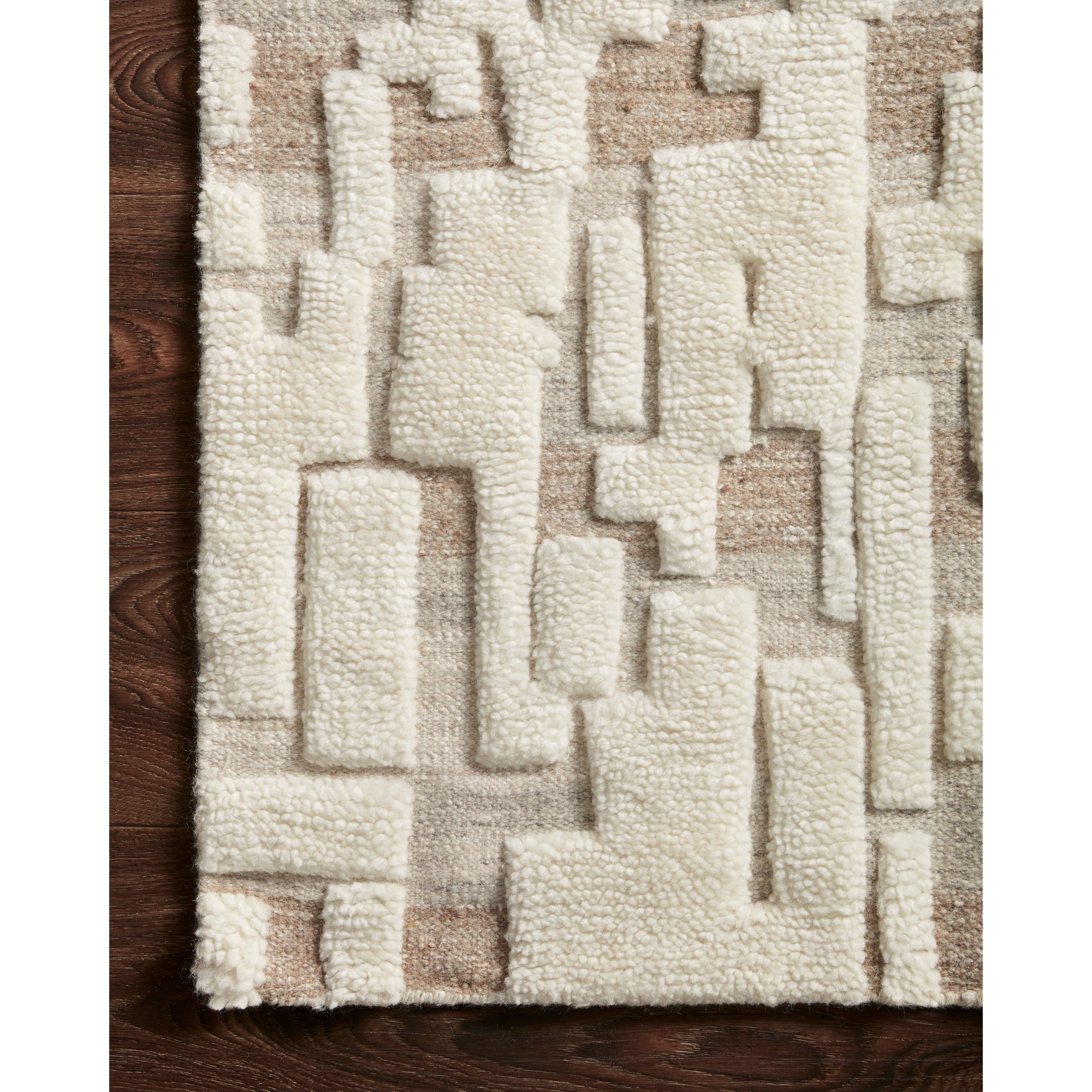 The Loloi Bennett Ivory / Taupe Area Rug, or BEN-05, is hand-knotted of wool, viscose and polyester in India. Featuring a new carve like high-low pile, Bennett has an ivory base with abstract tonal designs. Plus, it's plush underfoot-- a great choice for your office, bedroom, or other medium traffic areas. 