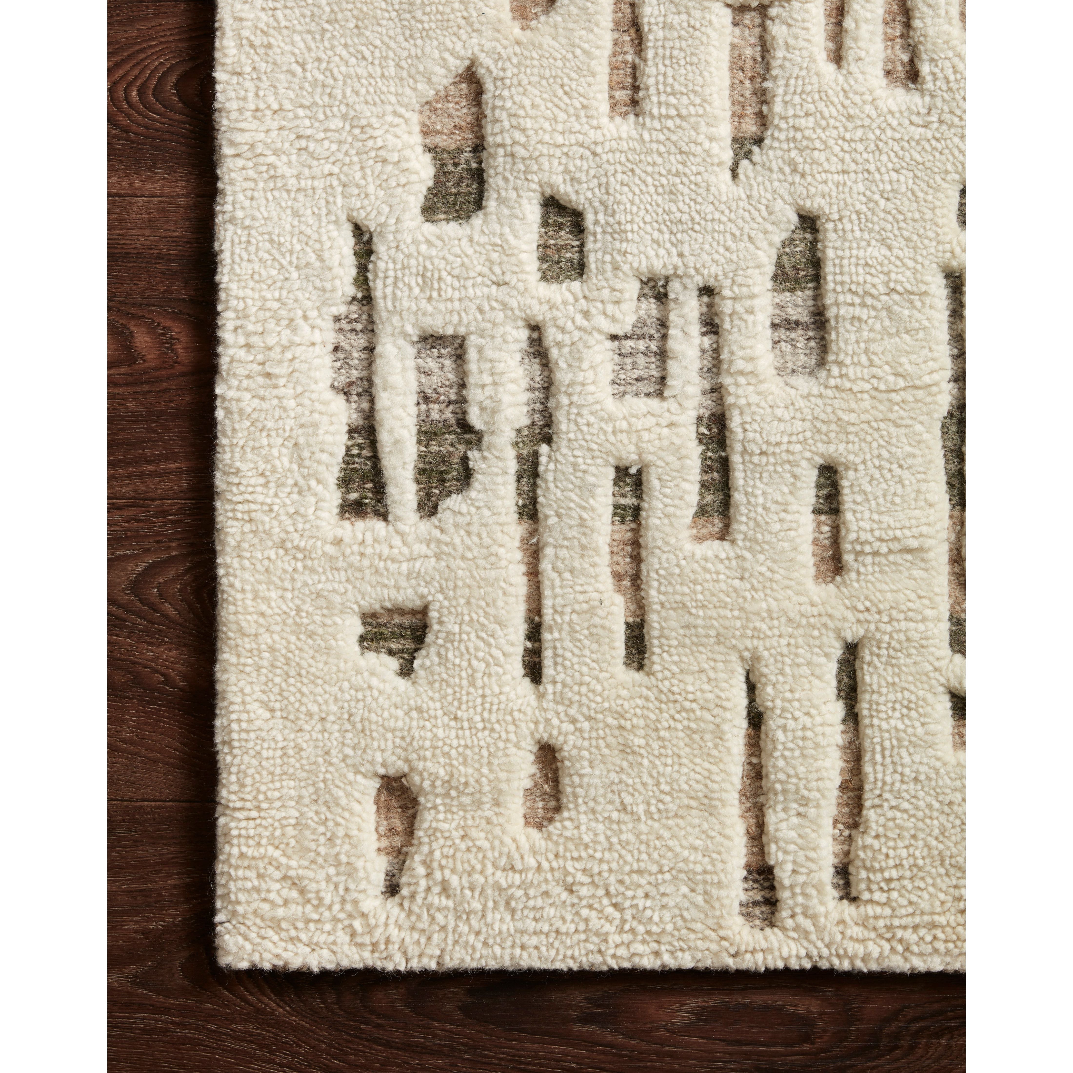 The Loloi Bennett Ivory / Forest Area Rug, or BEN-06, is hand-knotted of wool, viscose and polyester in India. Featuring a new carve like high-low pile, Bennett has an ivory base with abstract tonal designs. Plus, it's plush underfoot-- a great choice for your office, bedroom, or other medium traffic areas. 