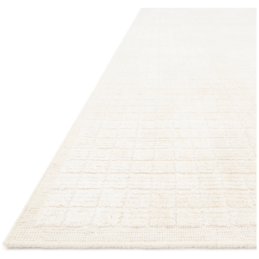 Modern and refined, the Beverly Ivory rug from Loloi is hand-loomed by master artisans of viscose and wool pile. Clean lines and minimalist hues allow you to layer Beverly into any room.  Hand Loomed 72% Viscose | 28% Wool BEV-01 Ivory