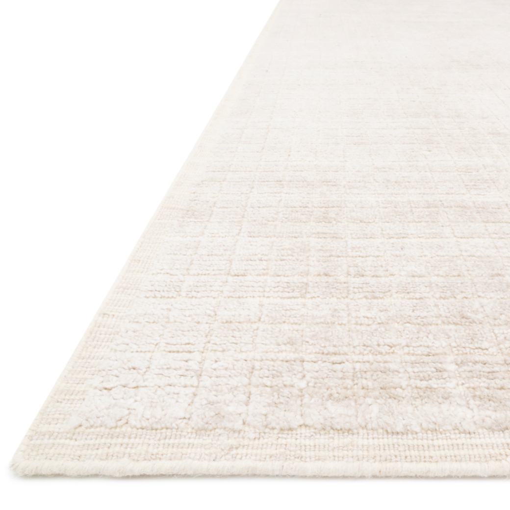 Modern and refined, the Beverly Natural rug by Loloi is hand-loomed by master artisans of viscose and wool pile. Clean lines and minimalist hues allow you to layer Beverly into any room.  Hand Loomed 68% Viscose | 32% Wool BEV-01 Natural