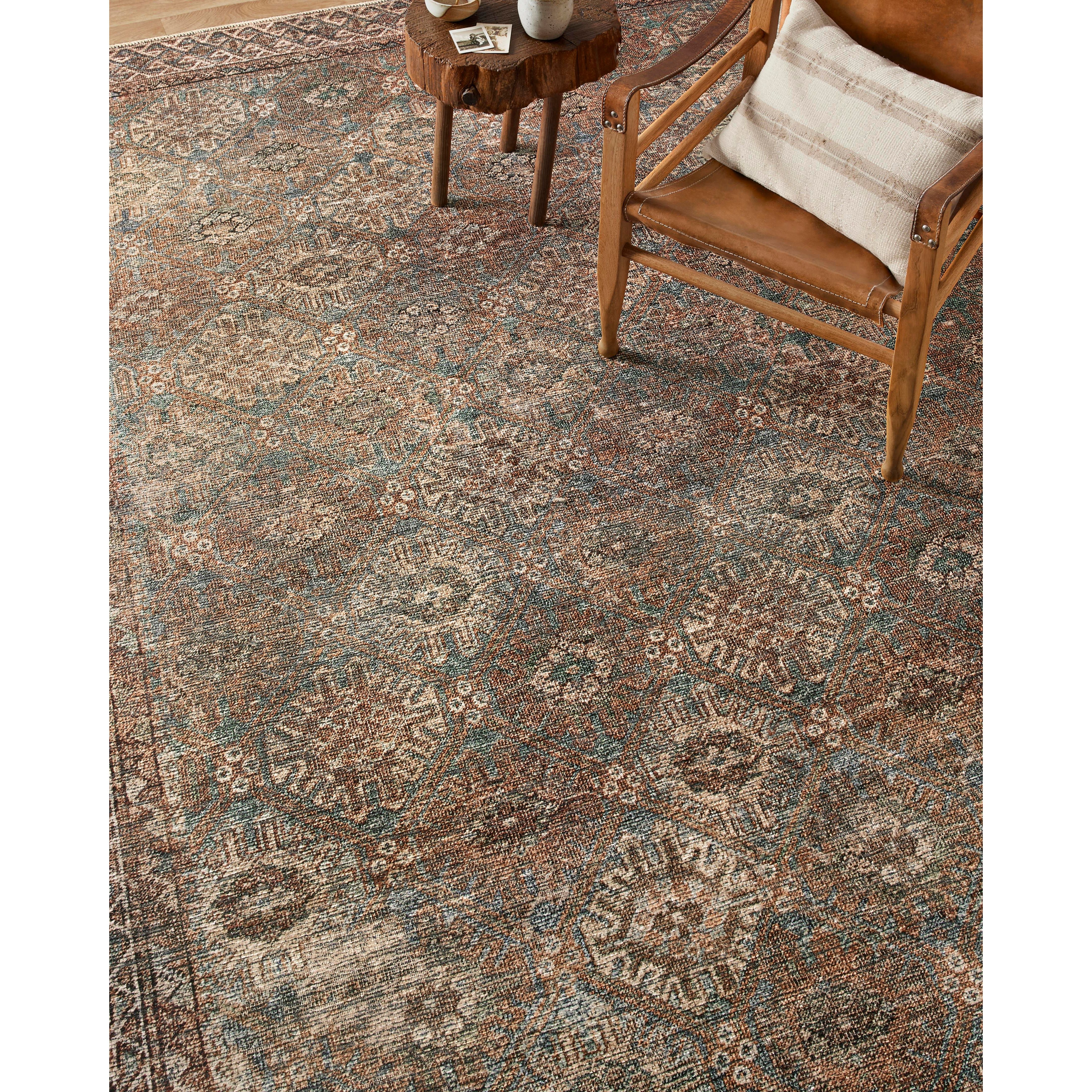 Touting richly saturated colors and a distressed pattern, the Billie Collection captures the look of a well-worn antique rug at a remarkable value. Reminiscent of one-of-a-kind rugs, this Amber Lewis x Loloi collection features random variations in color that render no two pieces exactly alike, creating up to 30% variance in color. BIL-04 AL Aqua / Rust