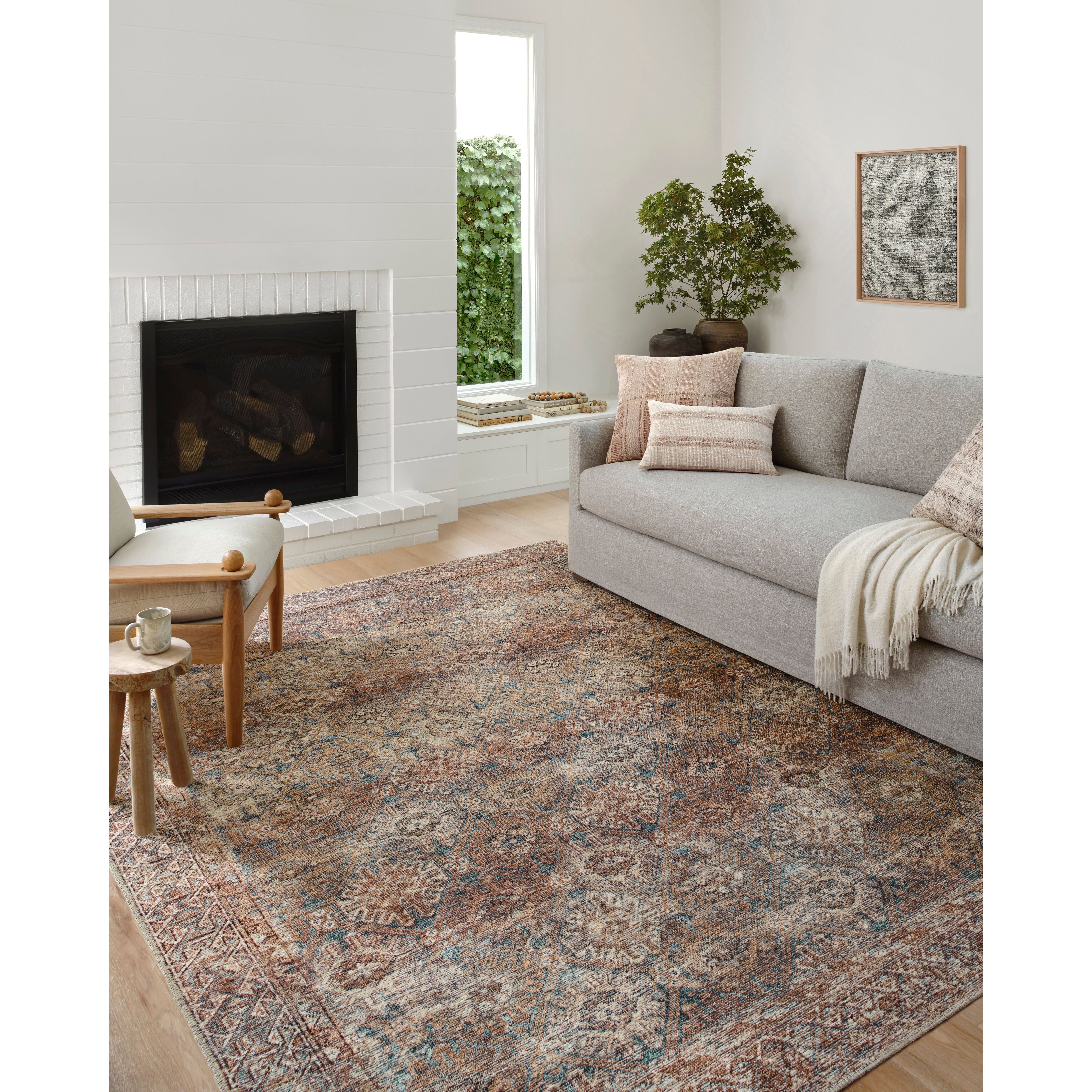 Touting richly saturated colors and a distressed pattern, the Billie Collection captures the look of a well-worn antique rug at a remarkable value. Reminiscent of one-of-a-kind rugs, this Amber Lewis x Loloi collection features random variations in color that render no two pieces exactly alike, creating up to 30% variance in color. BIL-04 AL Aqua / Rust