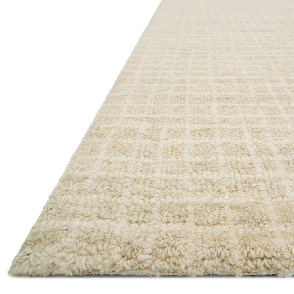 Inspired by textural watercolors, the Giana Antique Ivory Area Rug combines a relaxed grid with soft variations of cream and ivory for an effortless and sophisticated look. Each area rug is hooked of 100% wool by artisans for a beautiful textural layer to your home. The soft textures of this area rug bring warmth and coziness to any room.  Hooked 100% Wool GH-01 Antique Ivory