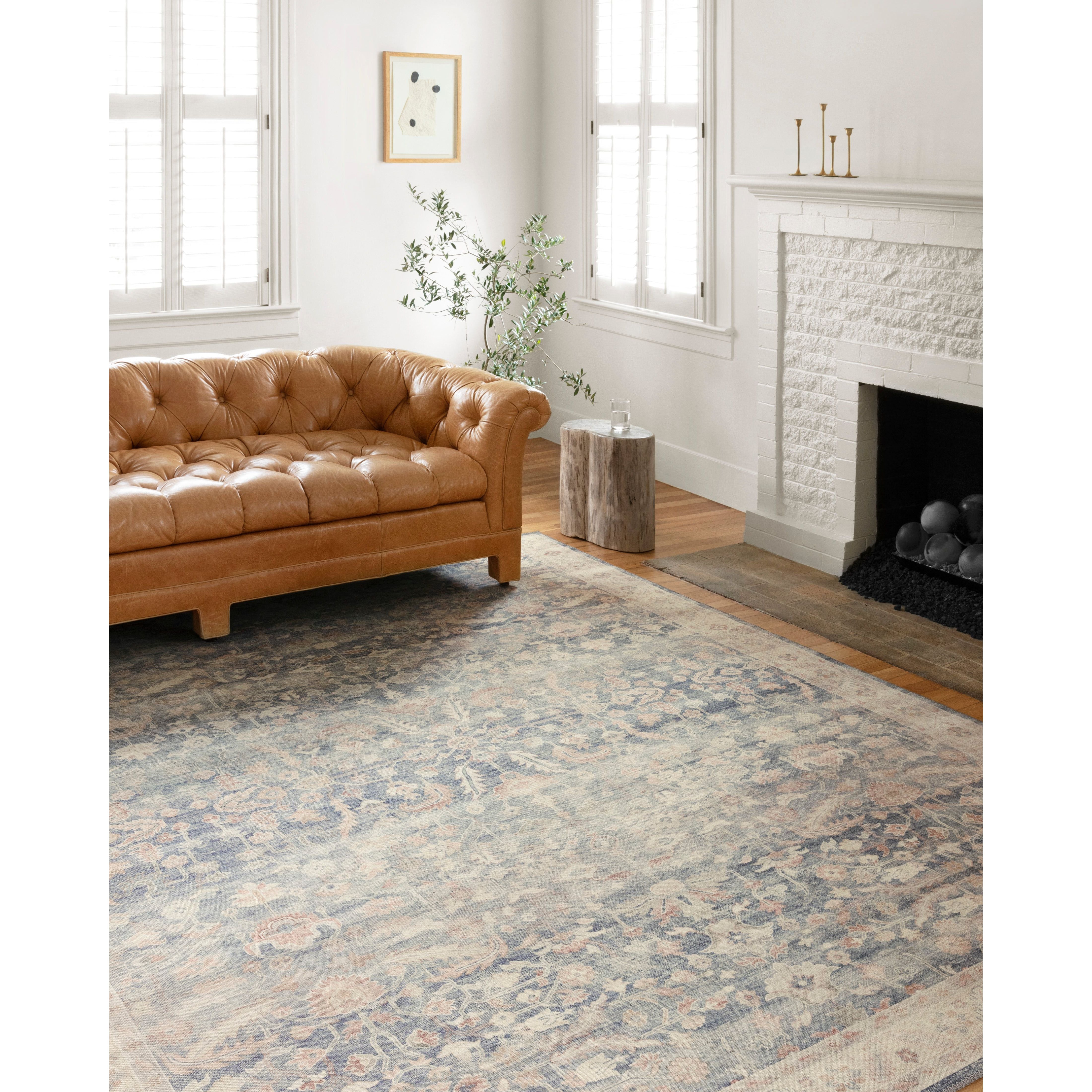 Featuring soft motifs in a carefully curated color palate of blue, yellow, red, and hints of orange, the Hathaway Denim / Multi area rug captures the essence of one-of-a-kind vintage or antique area rug at an attractive price.