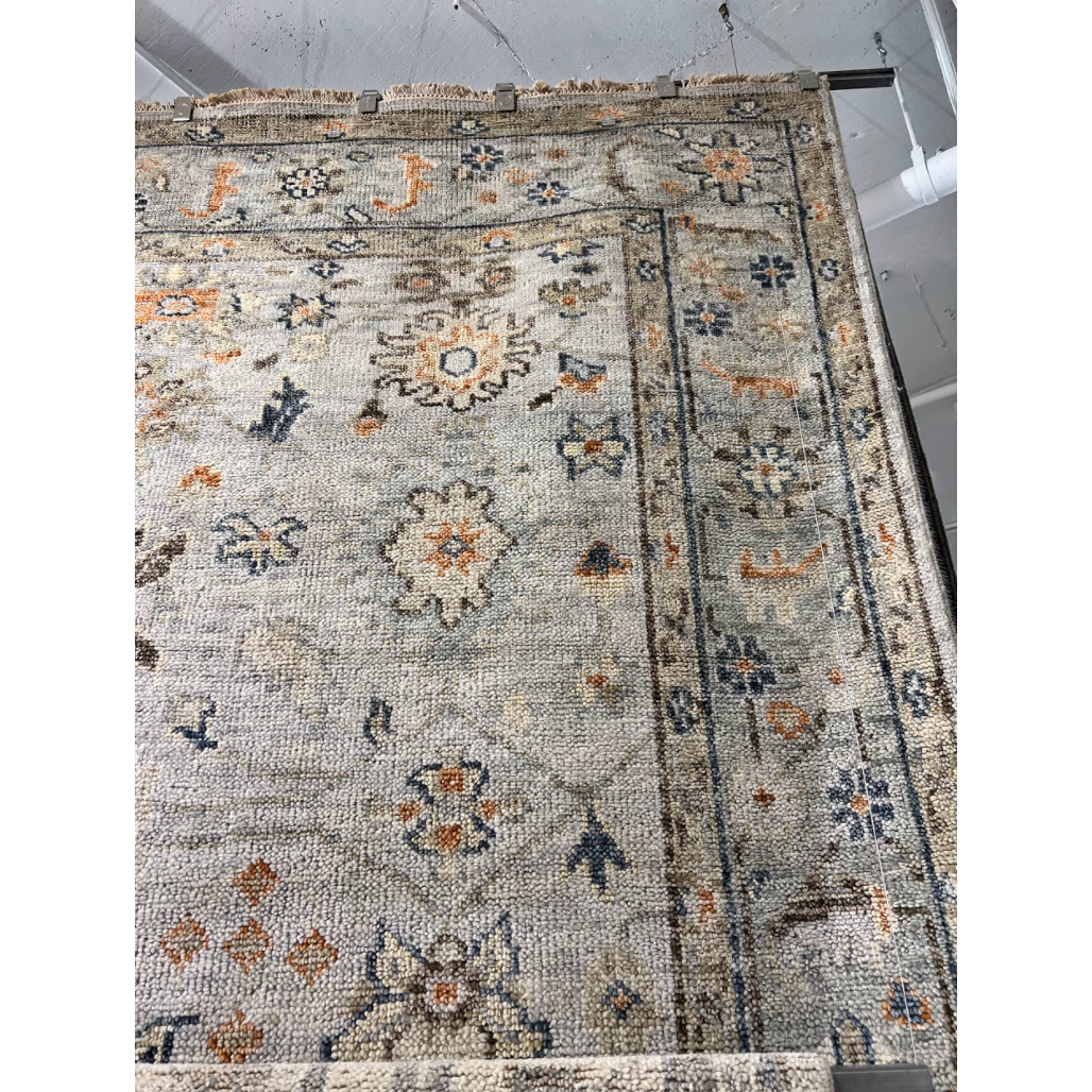 The Helena Beige / Rust HEL-08 area rug from Loloi is hand-knotted of 100% wool, refined, yet versatile for any home. The Helena rug combines weathered tones and worldly patterns for a beautiful grounding element in any room.