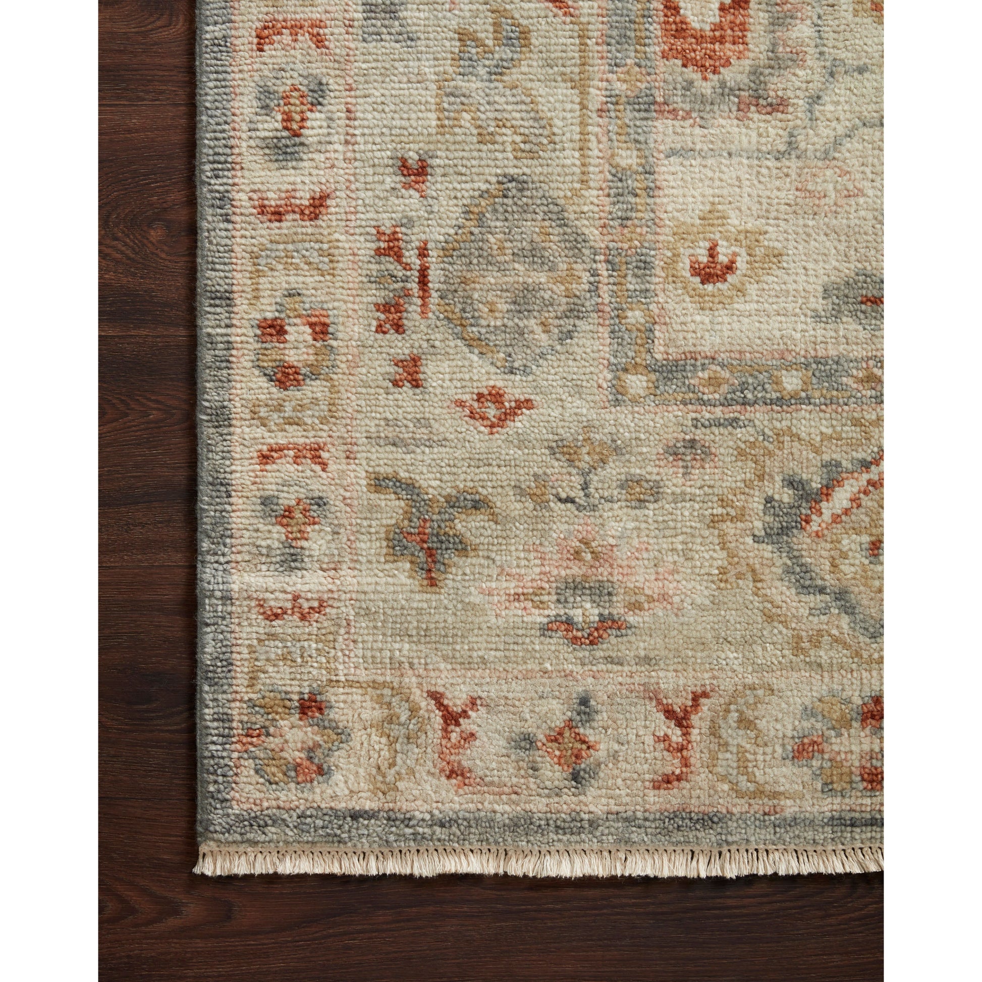 The Helena Beige / Rust HEL-08 area rug from Loloi is hand-knotted of 100% wool, refined, yet versatile for any home. The Helena rug combines weathered tones and worldly patterns for a beautiful grounding element in any room.